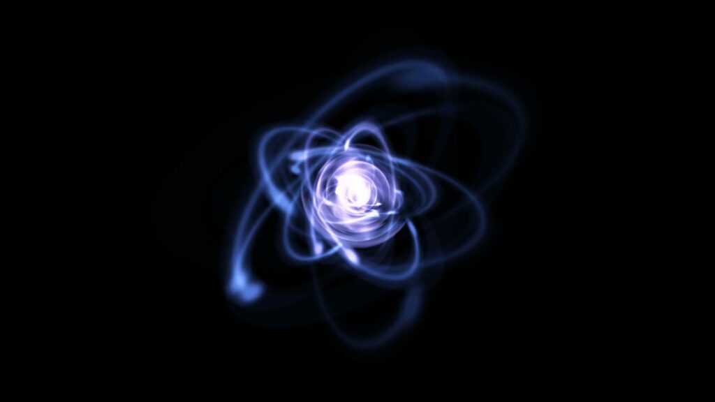 A captivating abstract looping video of swirling blue energy centered around a glowing white core against a black background, resembling a cosmic or atomic phenomenon.