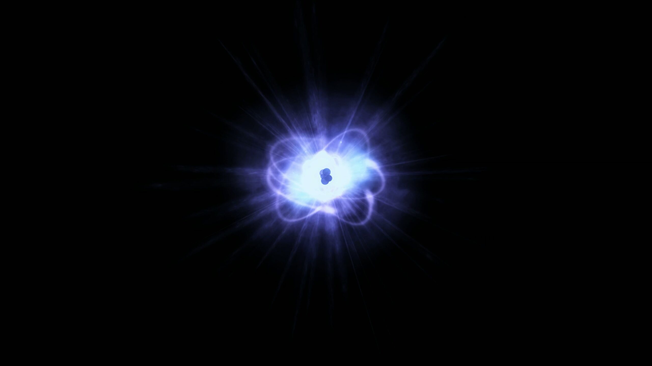 4K video loop of a luminous 3D animation of atomic structure with glowing subatomic particles against a dark background.