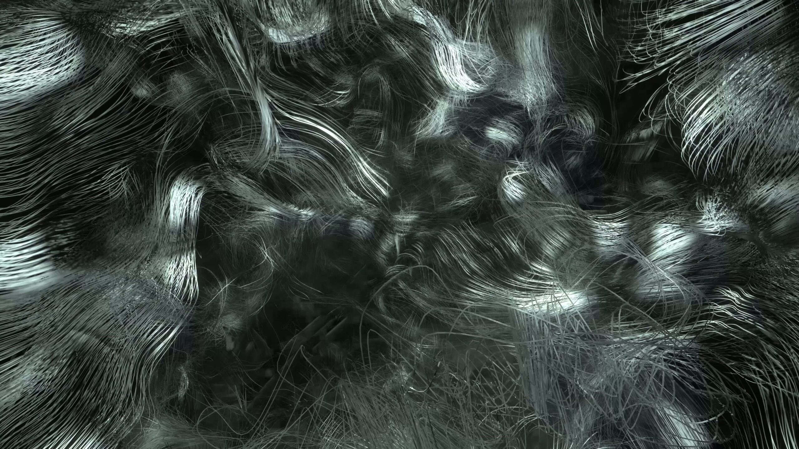 A mesmerizing abstract animation with silver and gray swirling patterns resembling silk and water.
