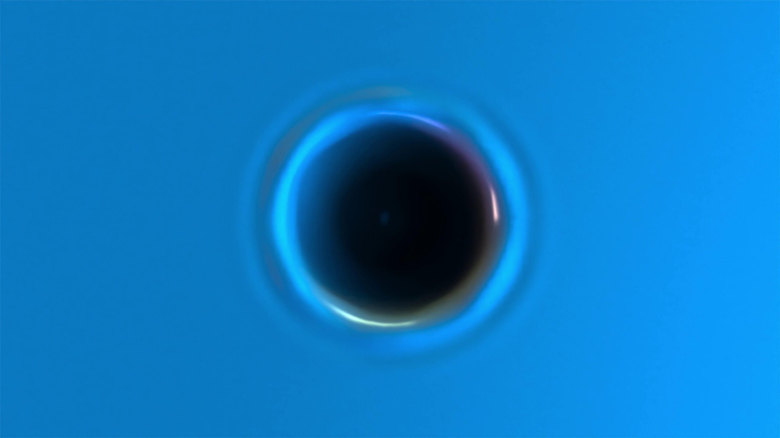Abstract 4K video loop glowing sphere surrounded by flowing blue liquid patterns.