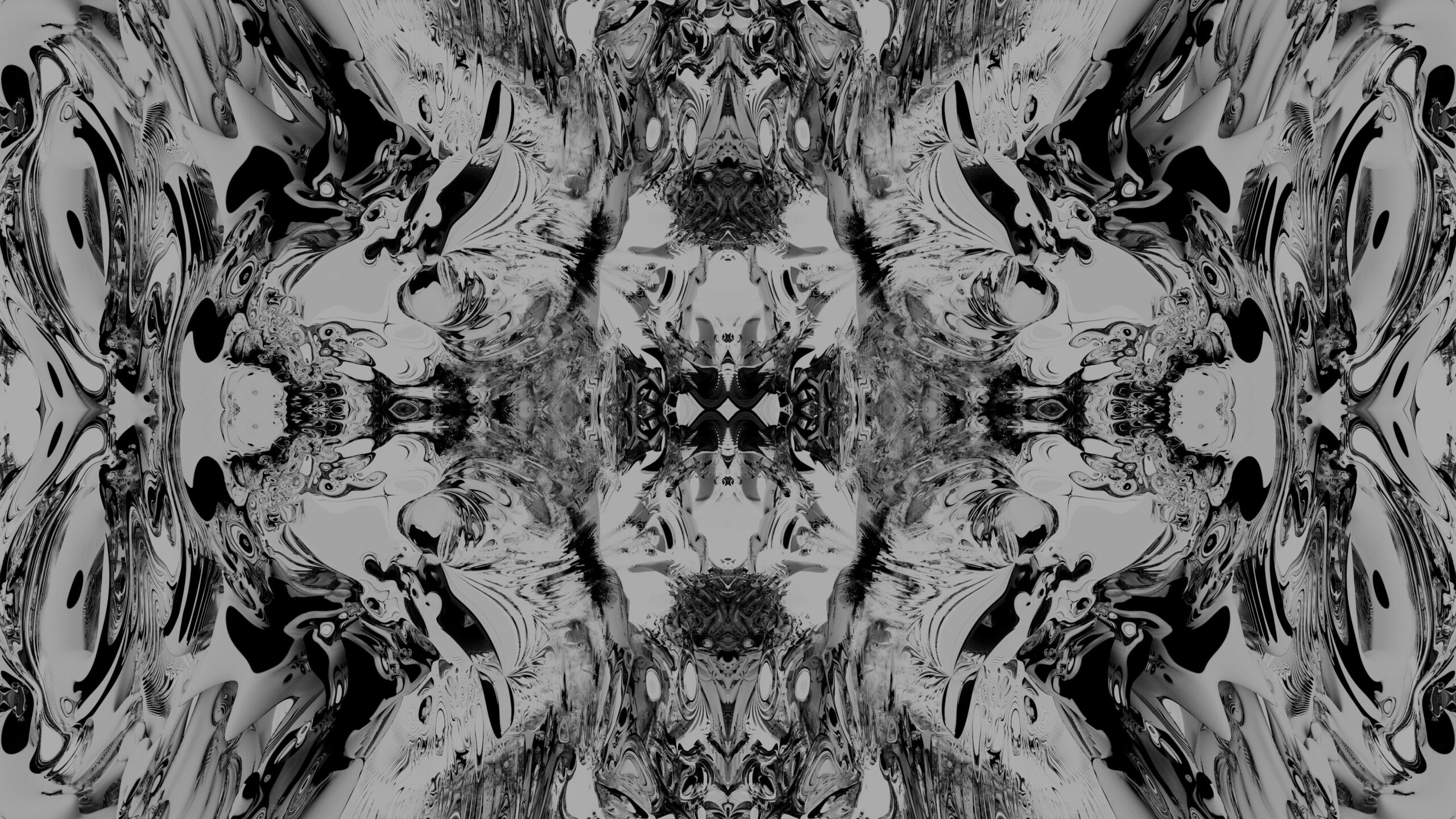 Black-and-white symmetrical patterns swirl dynamically throughout animated frames.