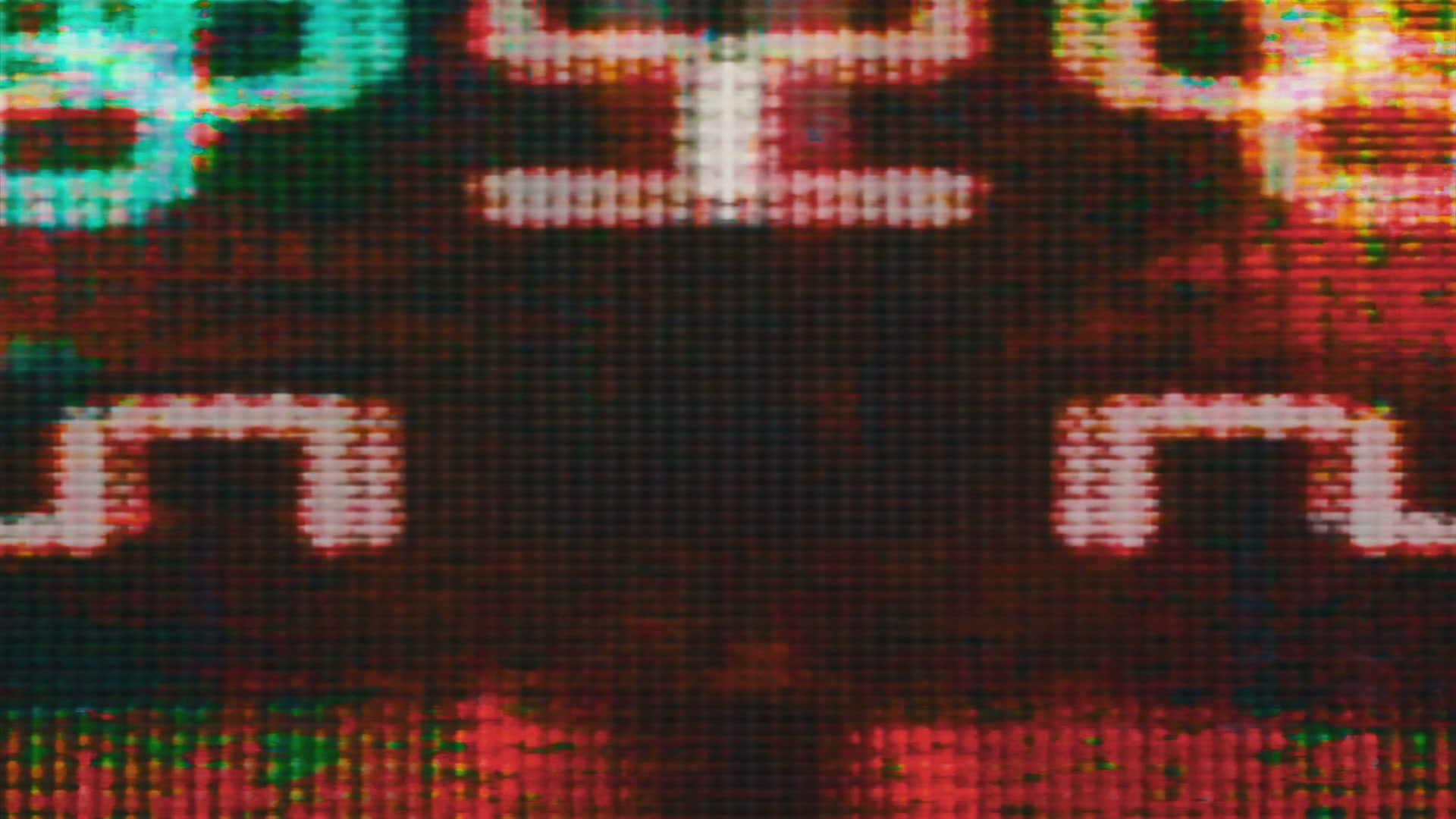 Close-up video loop of a digital screen displaying vibrant pixelated graphics in red, green, and yellow with an abstract pattern, highlighting the retro and technological aesthetic.