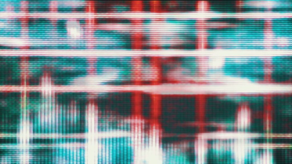 Close-up of a vibrant red and blue abstract digital video loop pattern with pixelated texture resembling an LED screen, highlighting modern and technological themes.