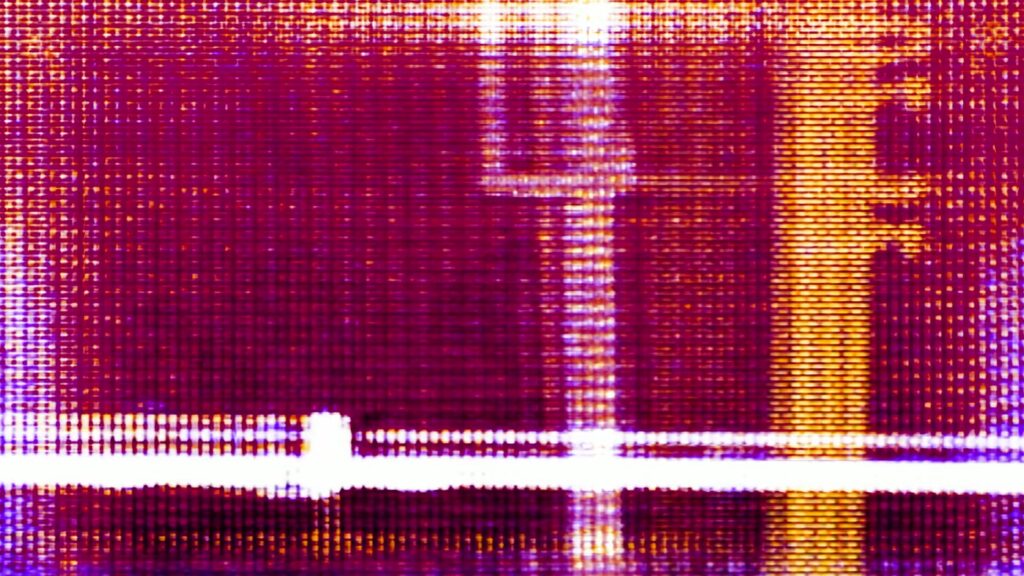 Vibrant abstract video loop of a digital technology screen featuring a purple and yellow grid patterns with intersecting lines, creating a textured and dynamic visual effect.