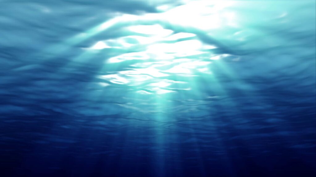 Underwater Sunbeams Illuminating Deep Blue Sea Waters