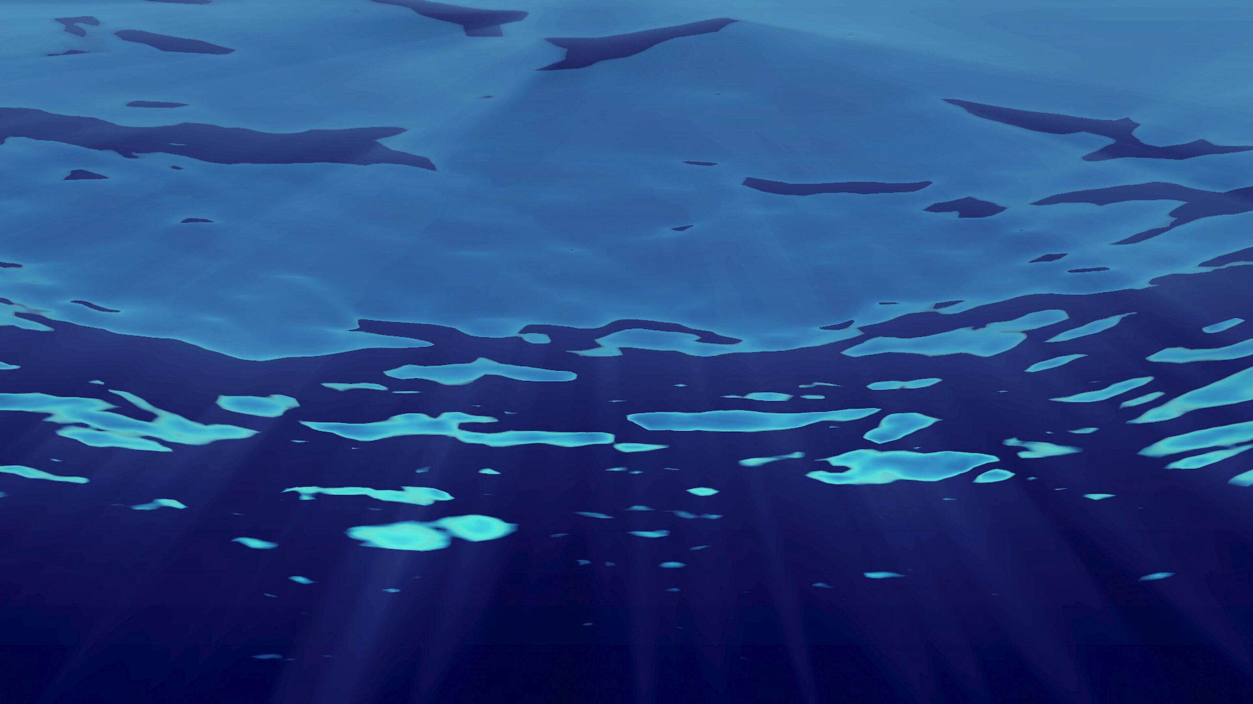 Underwater view of rippling waves and sinking light shafts.