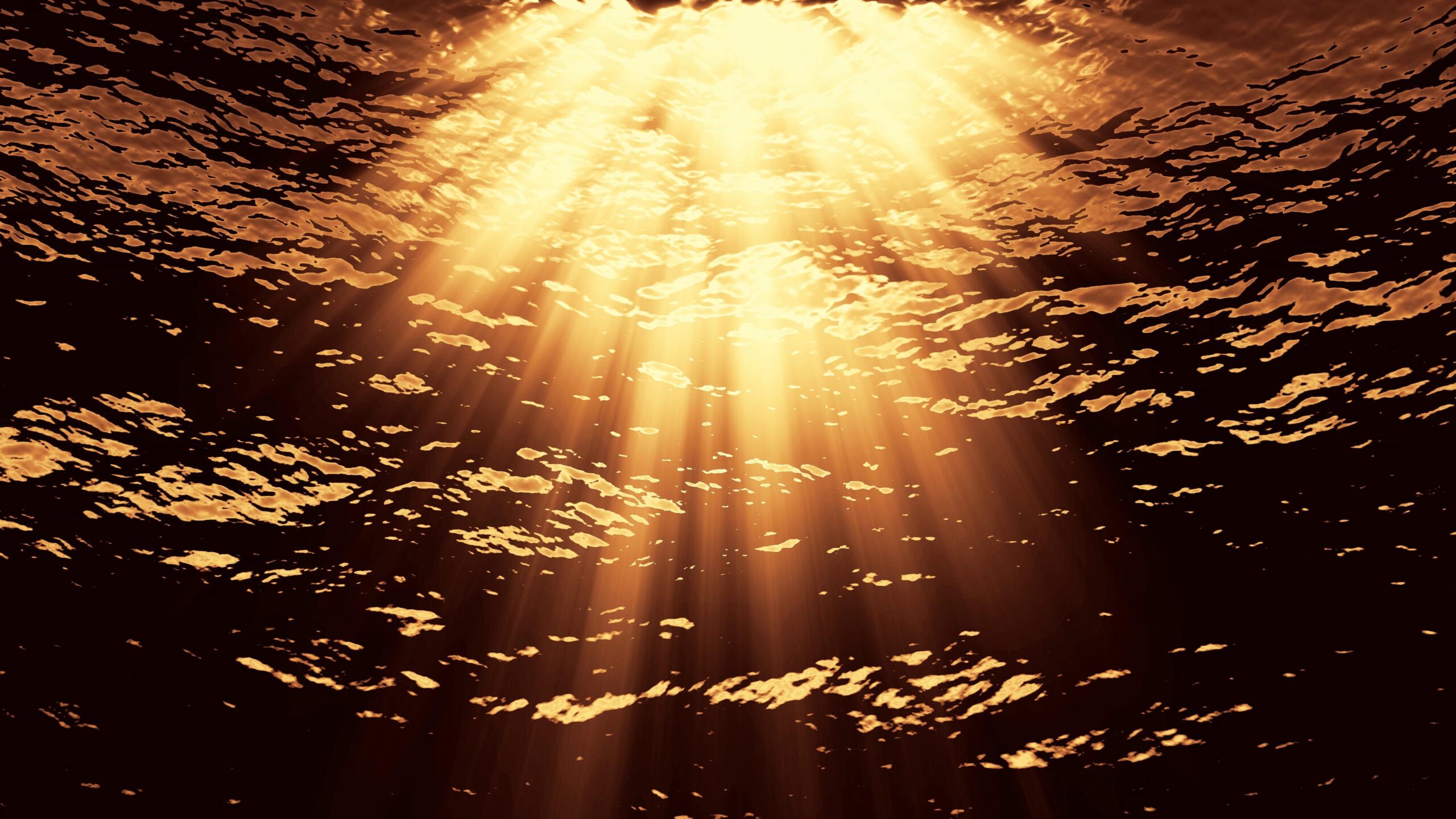 Sunbeams penetrate ocean waves, glowing warmly.