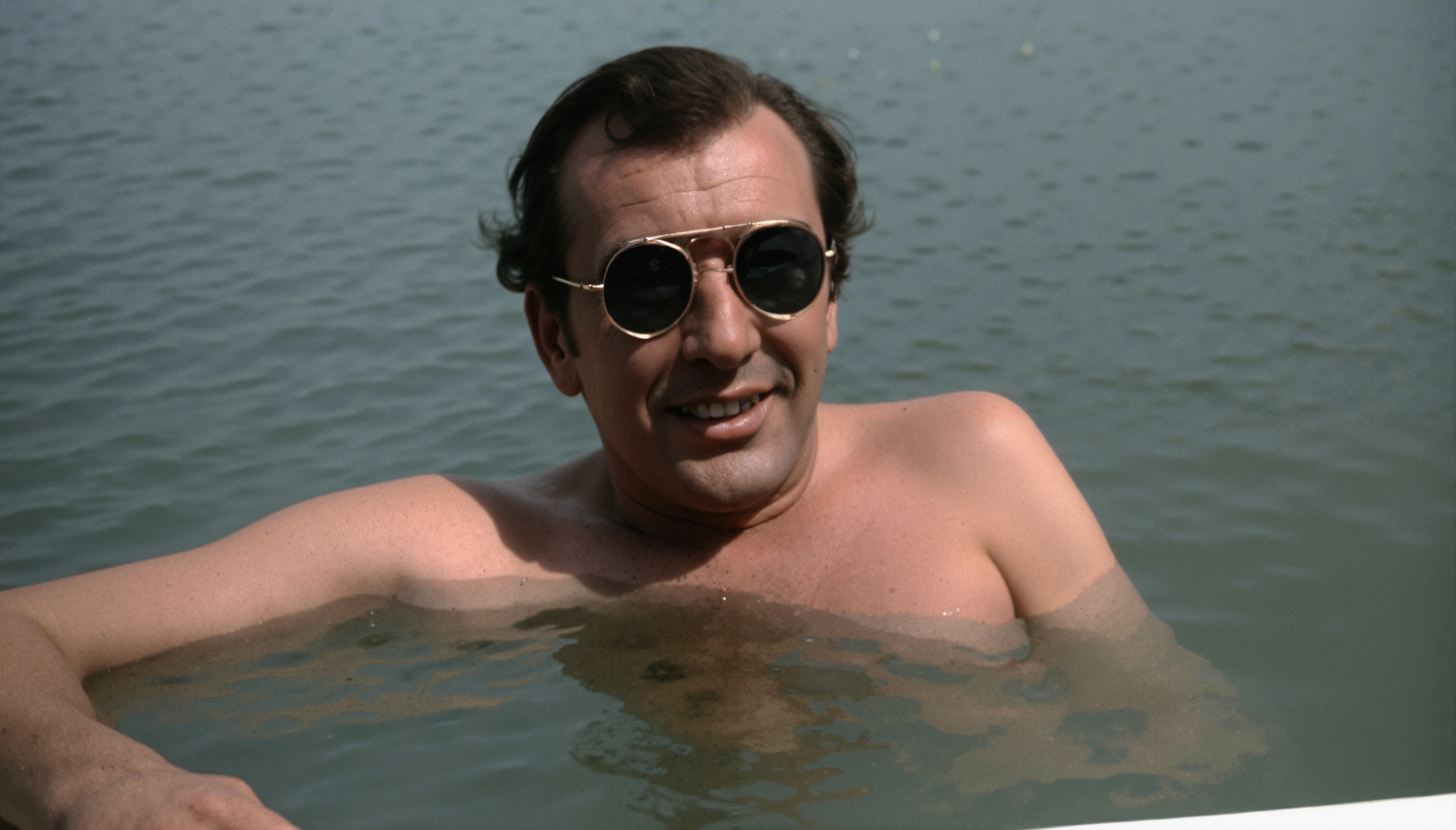 Relaxed Man in Reflective Sunglasses