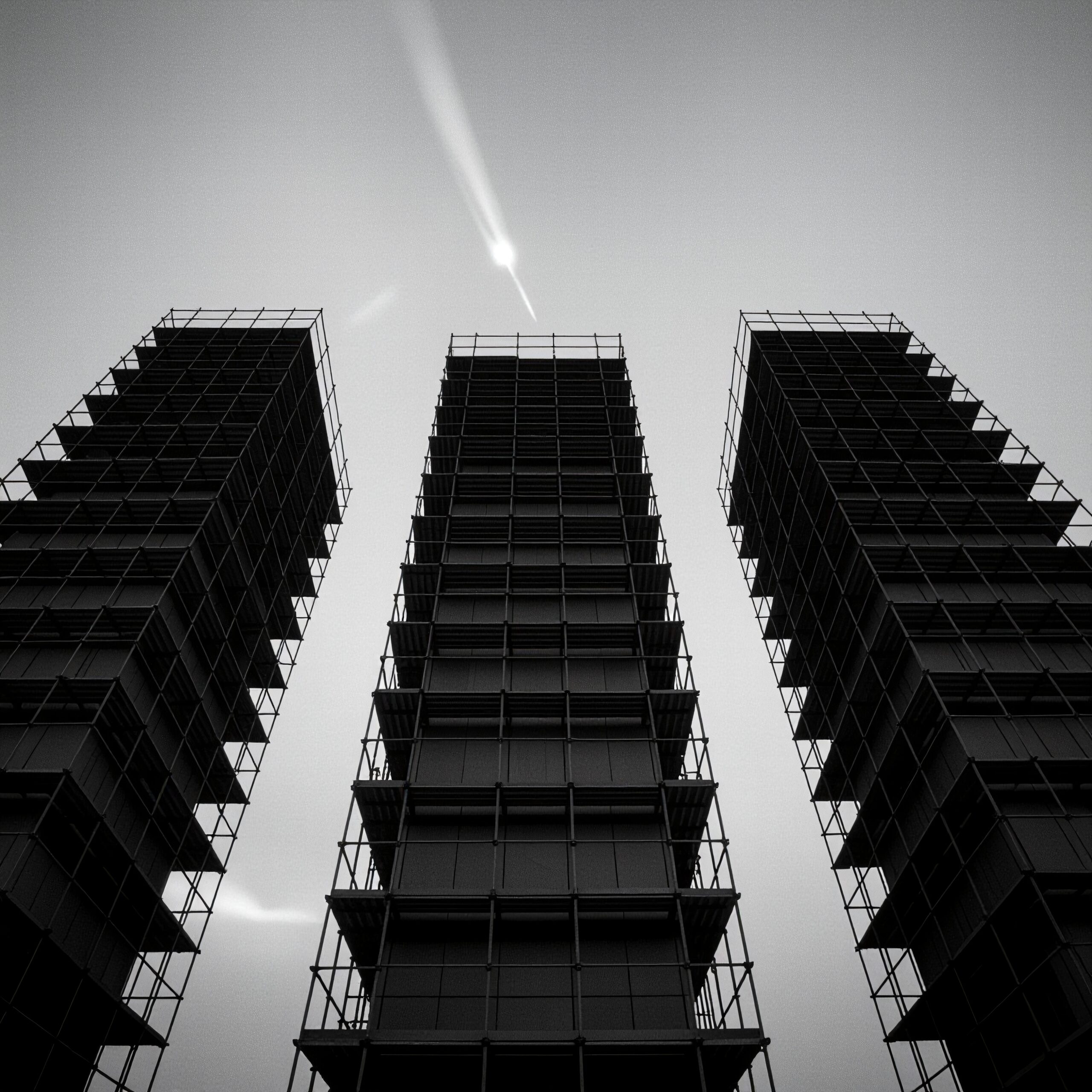 Dramatic urban skyline with towering structures.