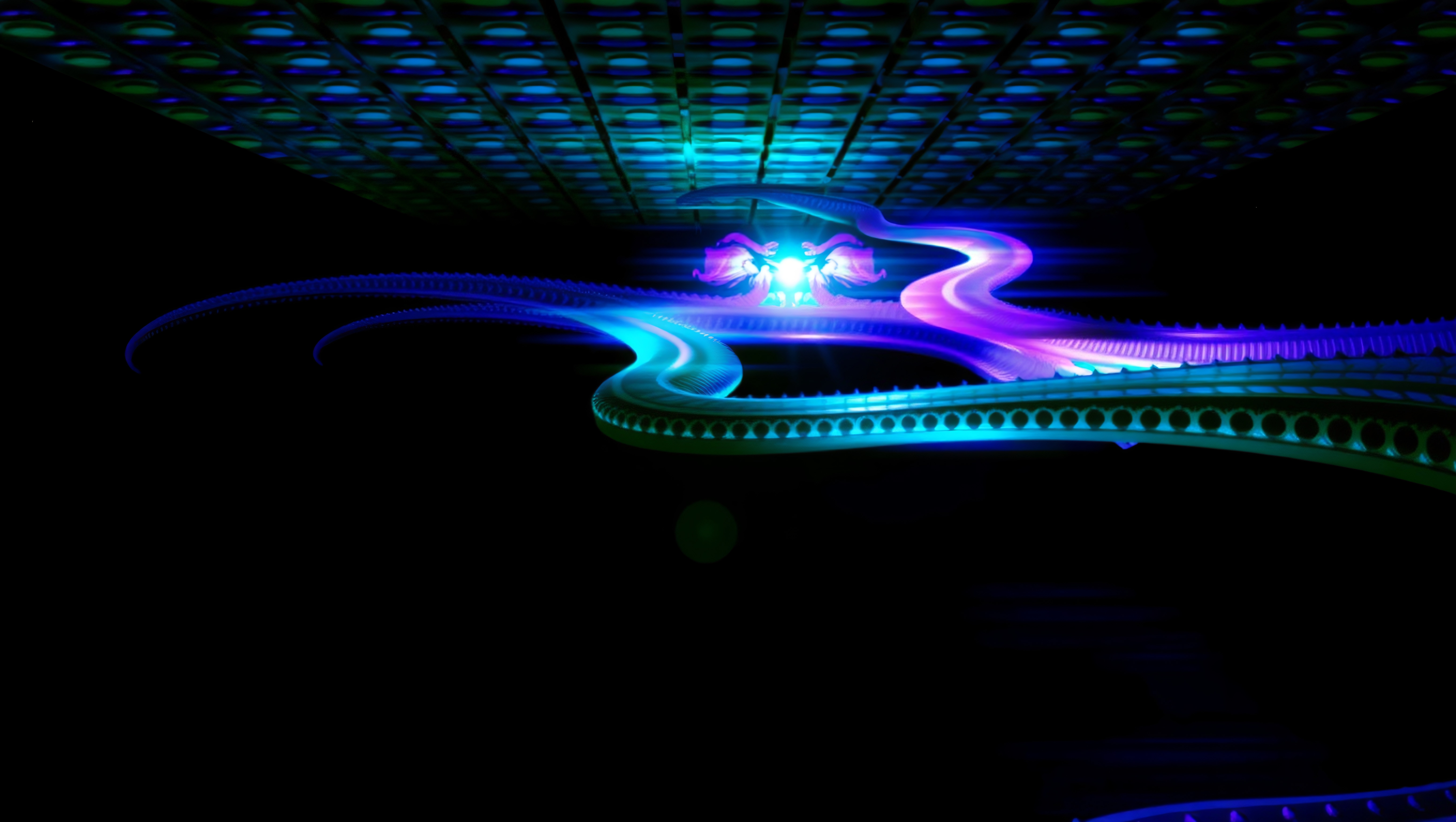 Abstract image of swirling neon lights and patterns creating a vibrant, futuristic art composition.