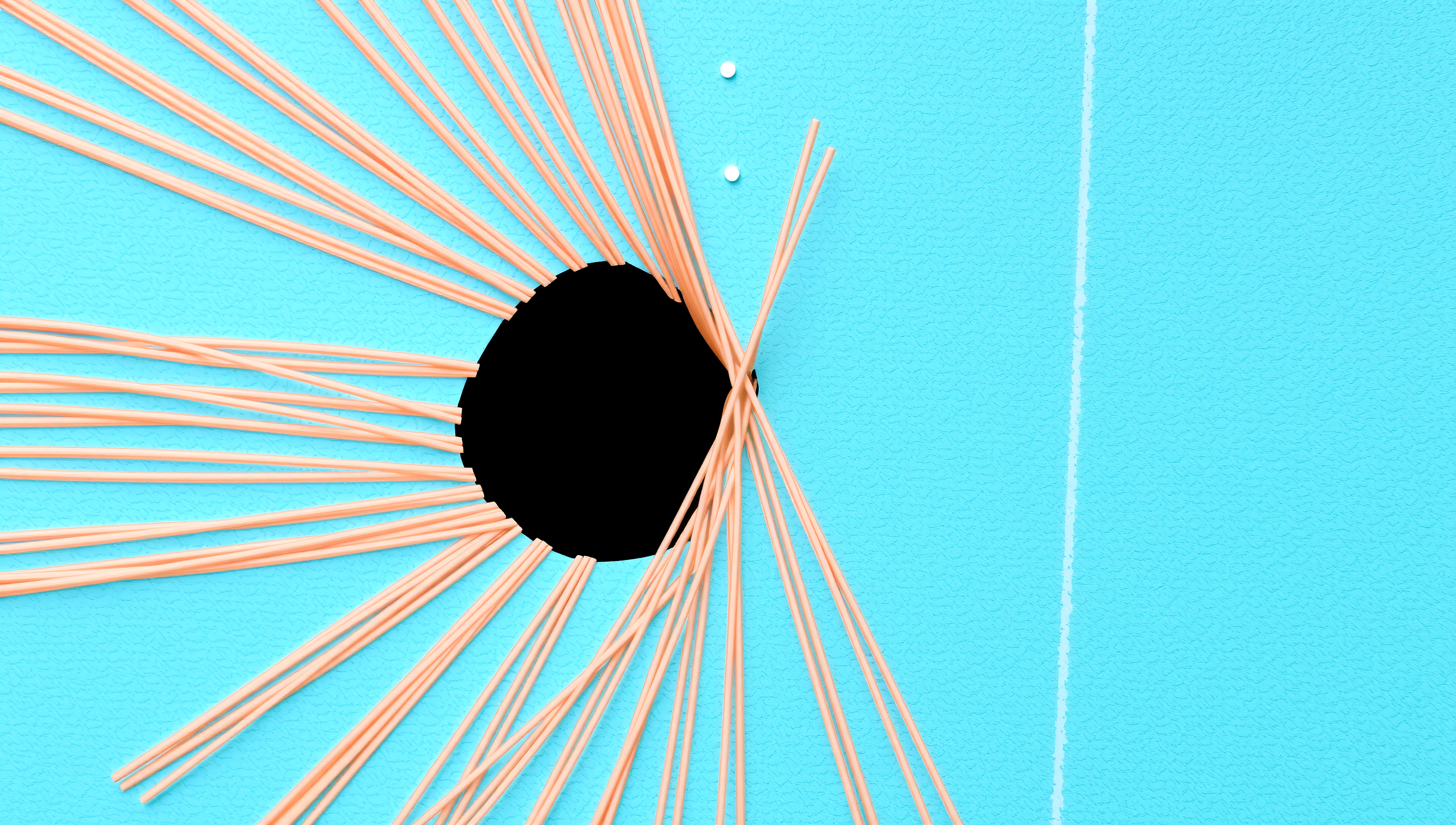 Abstract image with a turquoise background, black circle, and peach lines radiating outward for a dynamic, artistic composition.