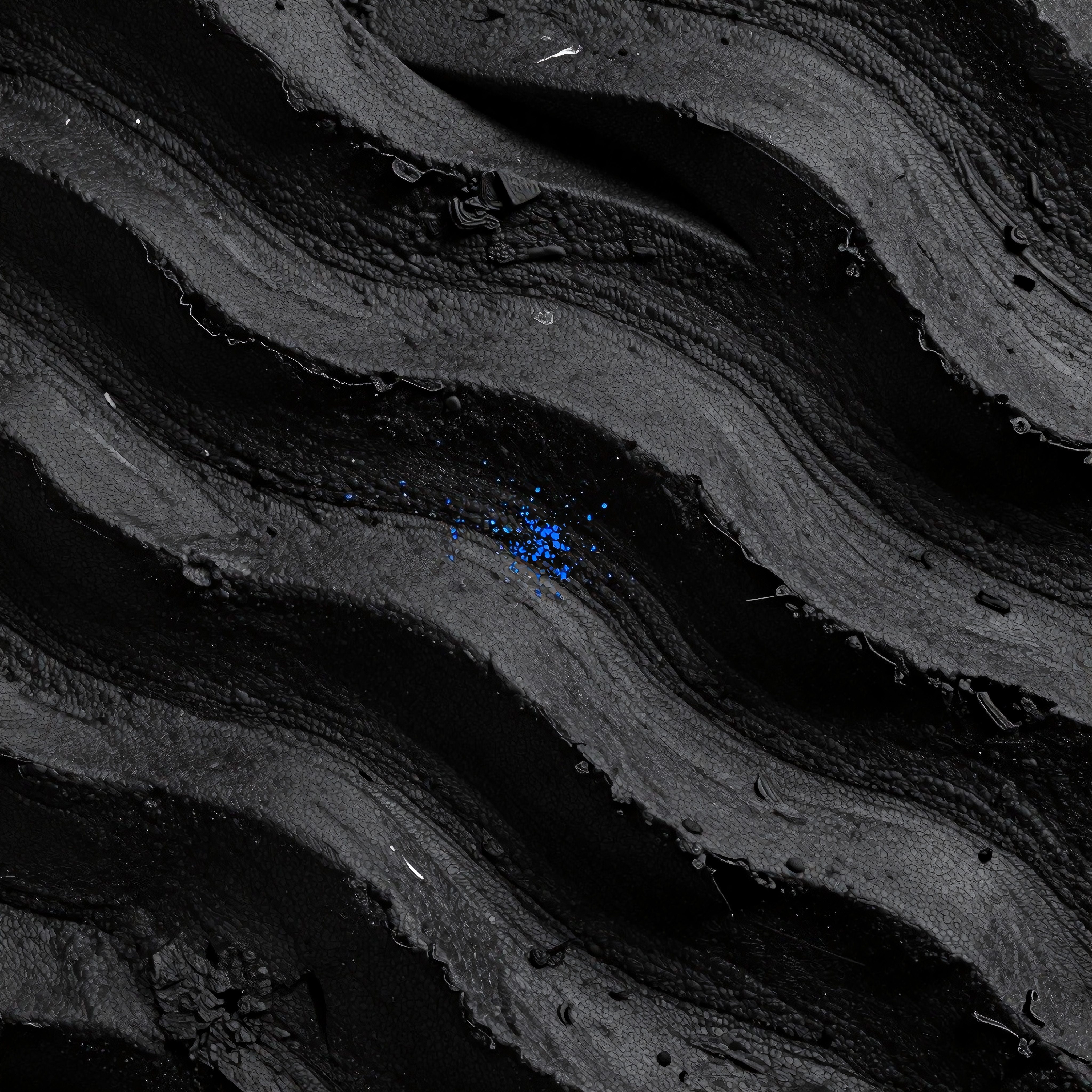 Abstract image of dark wavy textures with striking blue speckles creating a captivating contrast.