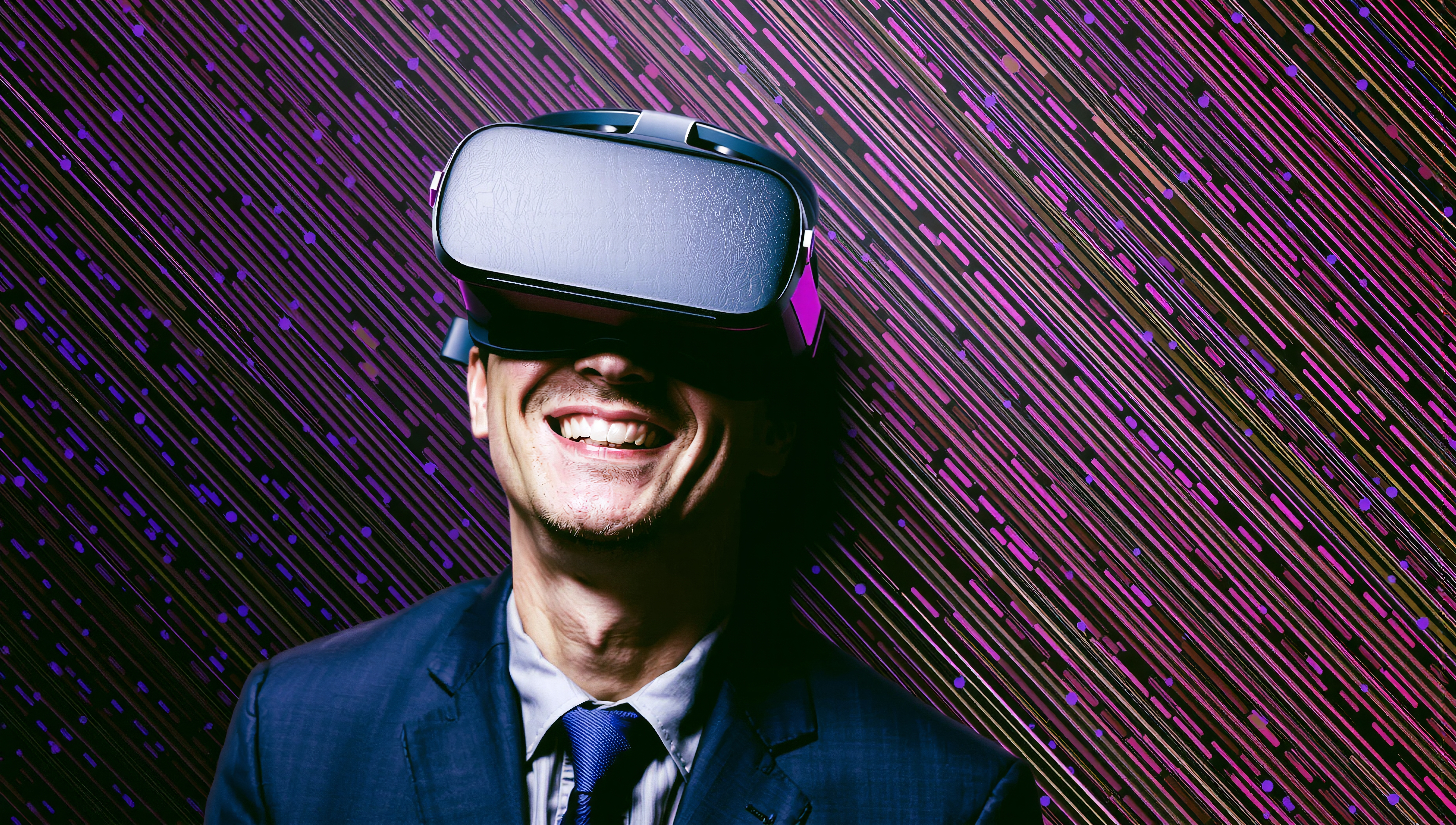 A smiling man in a virtual reality headset with purple patterned background.