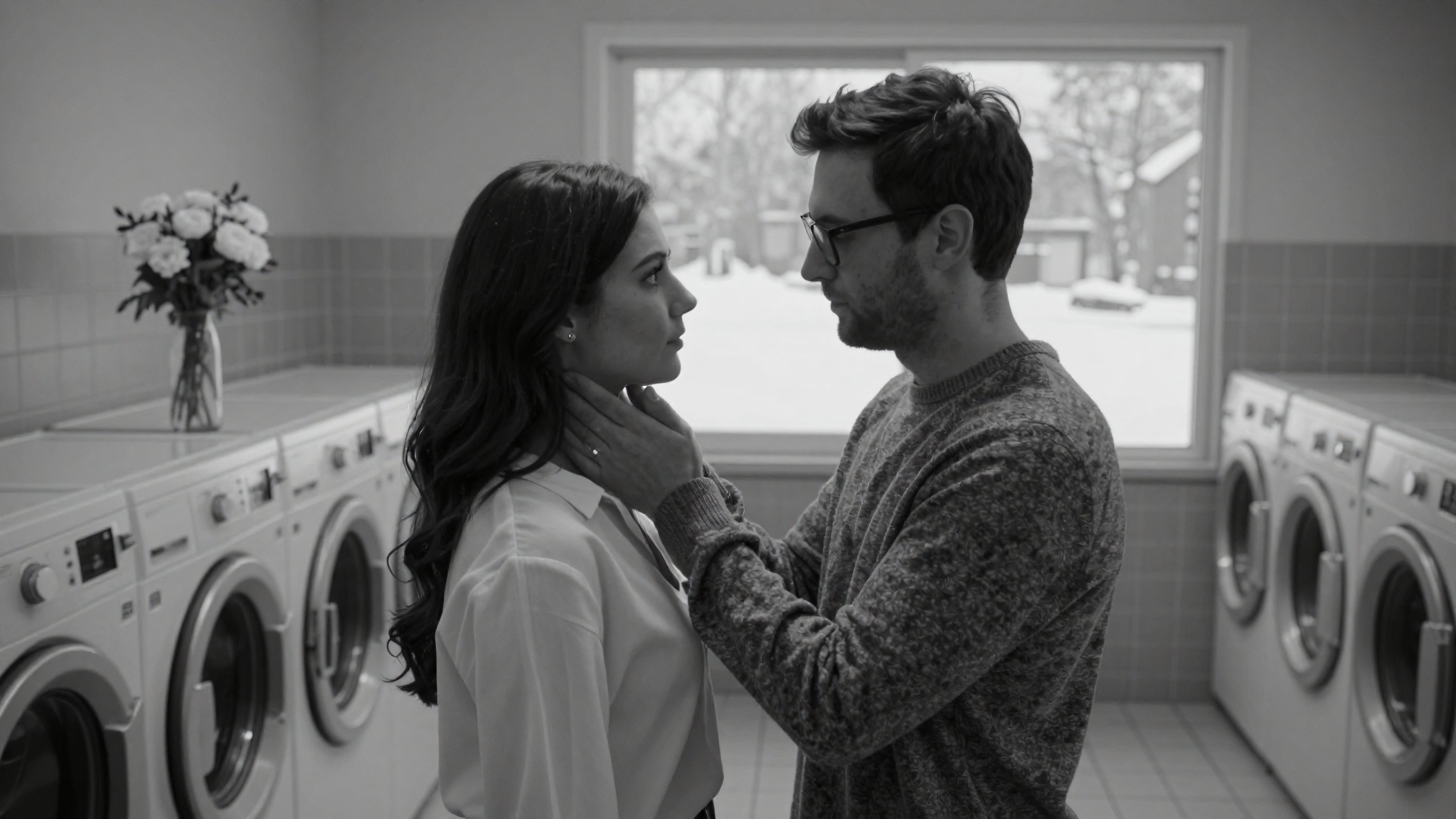 Intimate couple sharing tender moment inside laundry room during winter