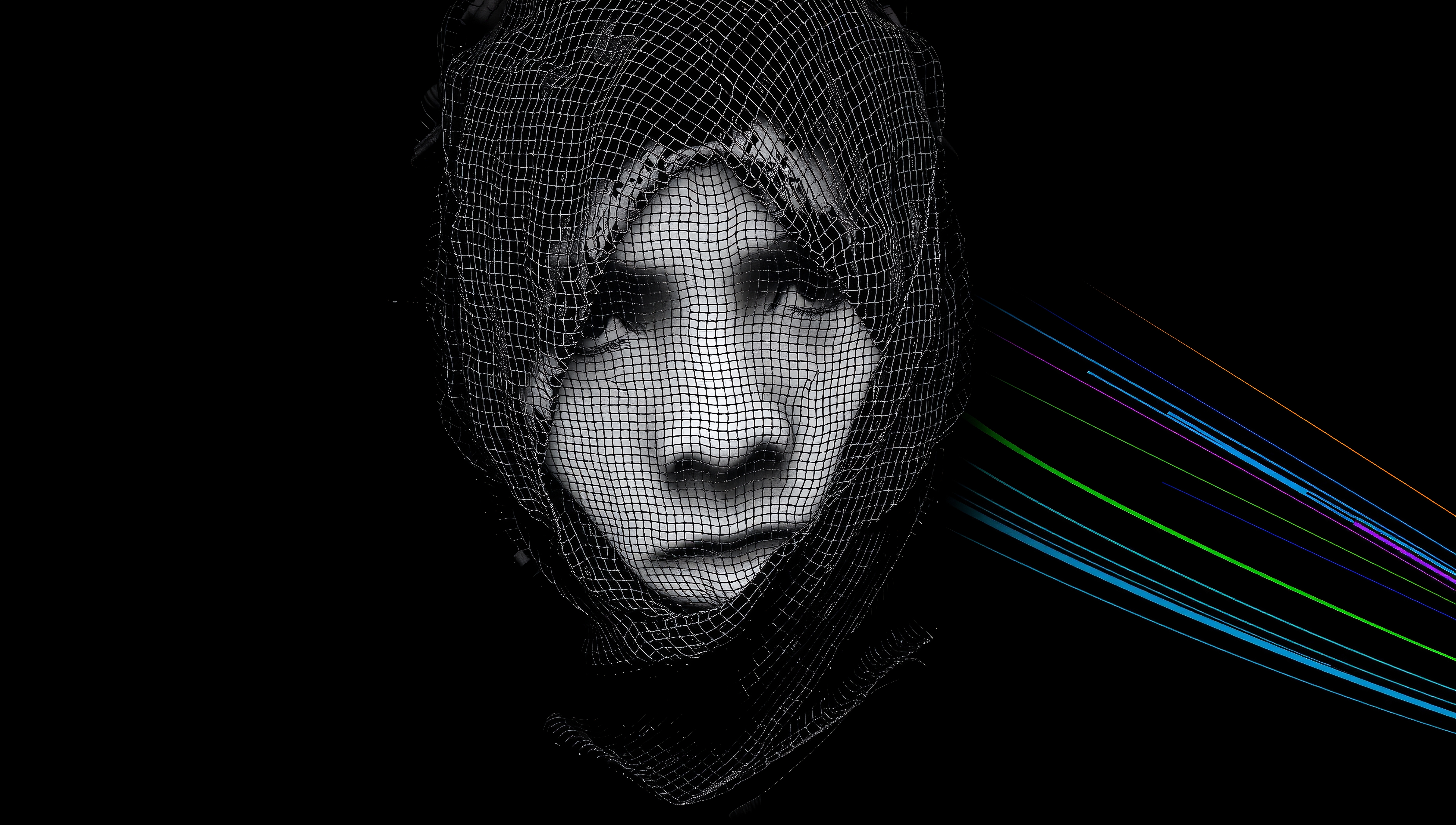 A digital portrait with a mesh overlay and colorful radiating lines.