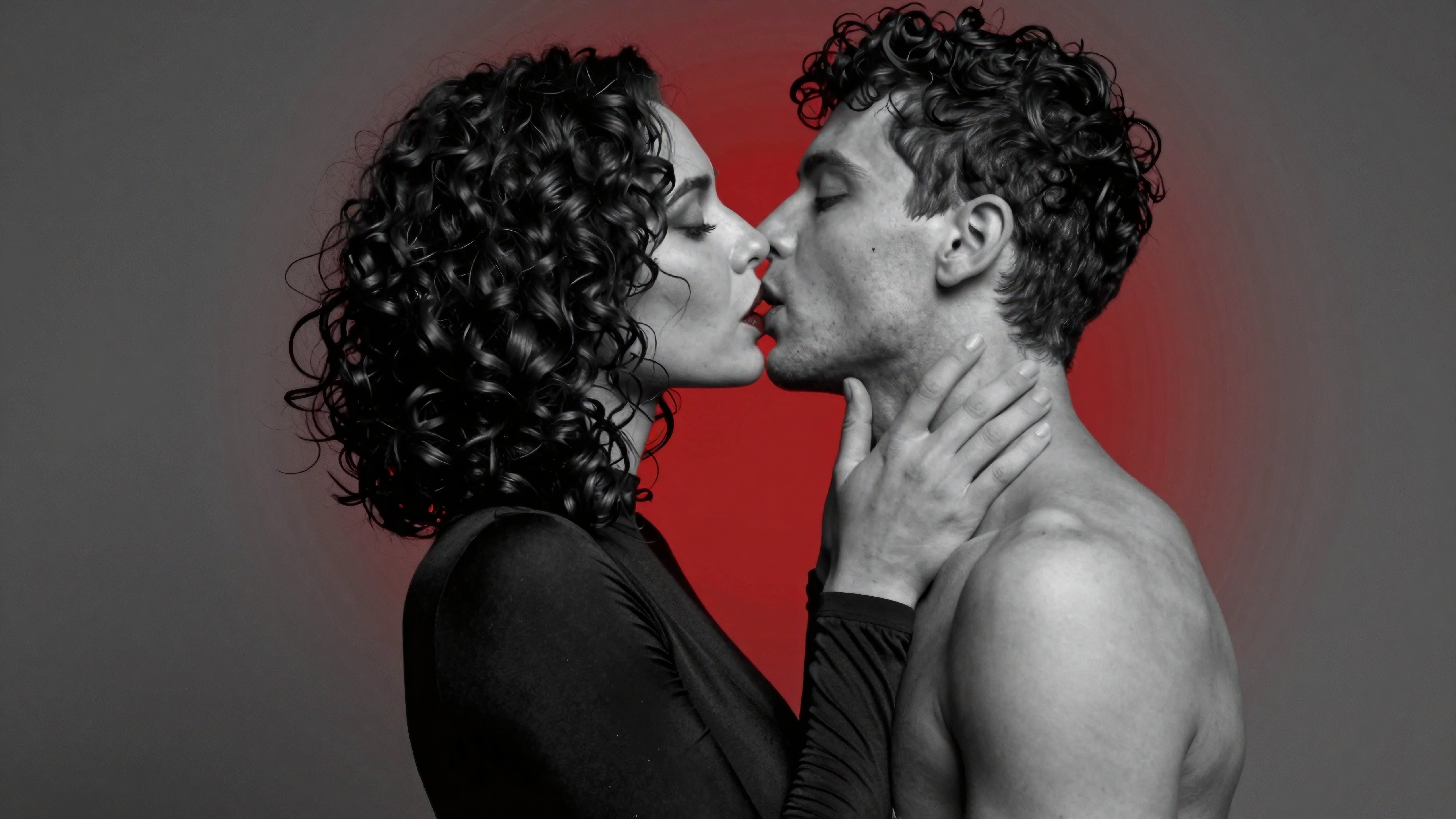 Intimate romantic couple kissing under dramatic red light photography portrait