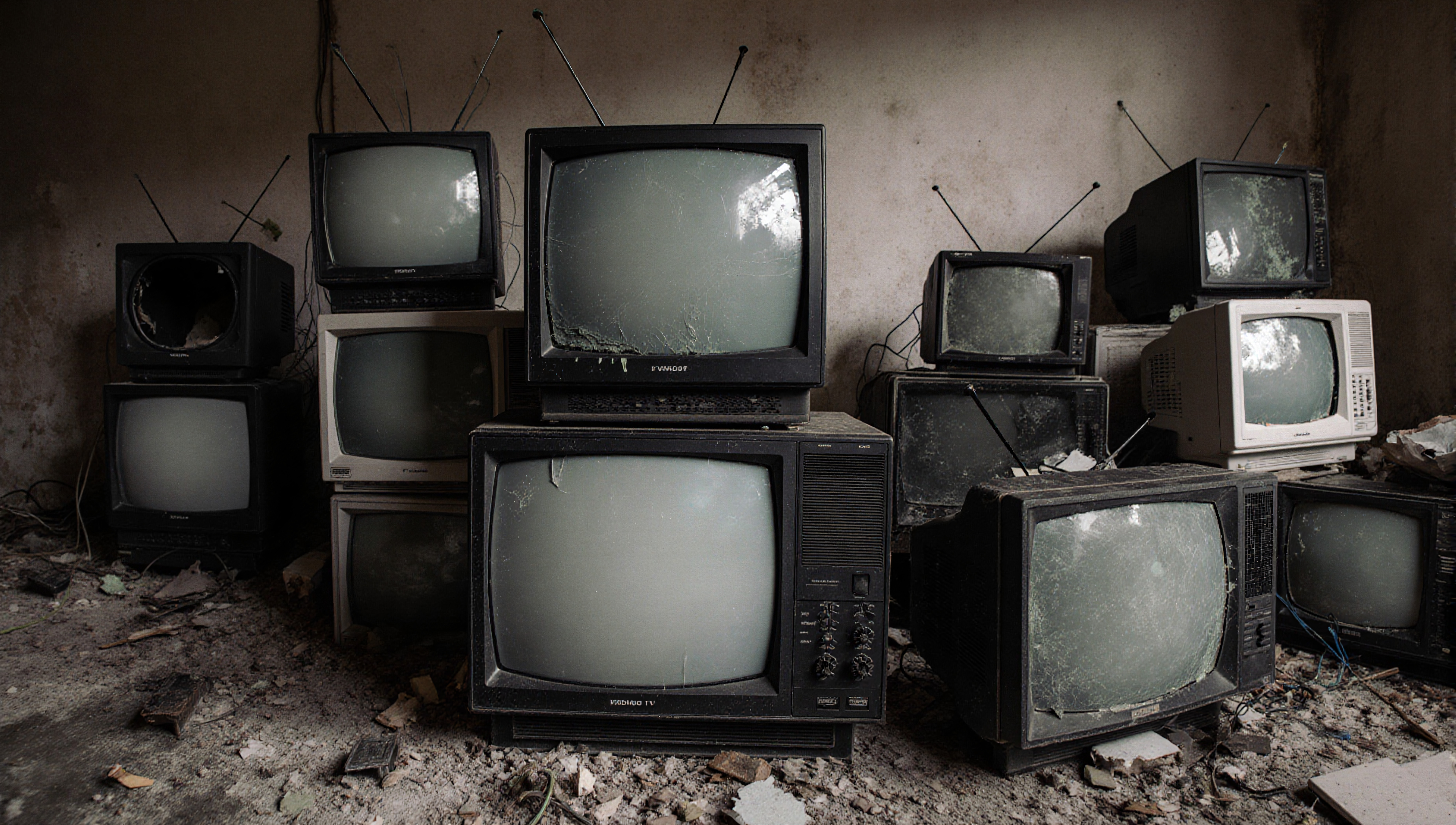 Abandoned Vintage Televisions in Dilapidated Room