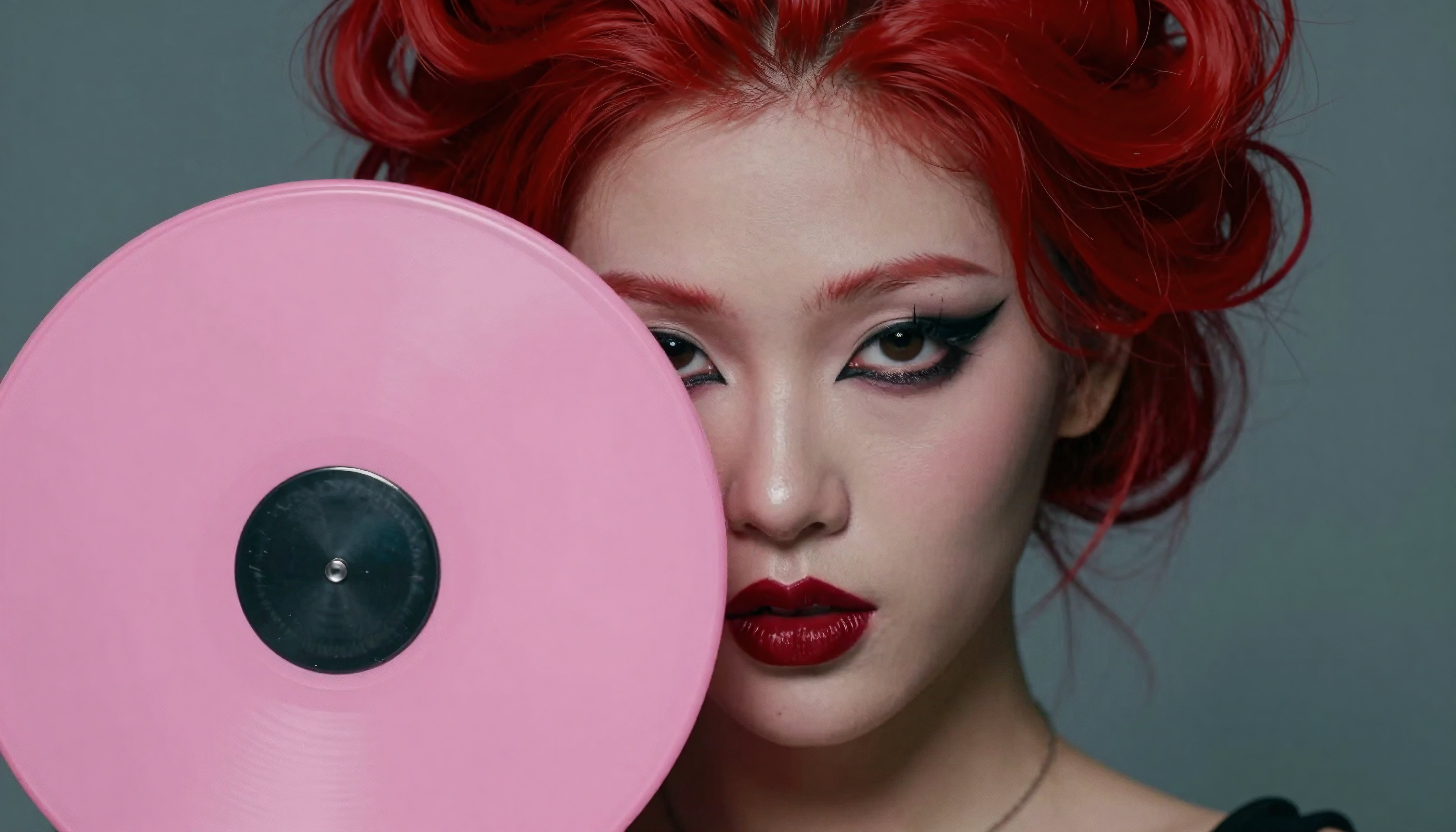 Red-Haired Model Holding Pink Vinyl Record Close-Up Studio Portr