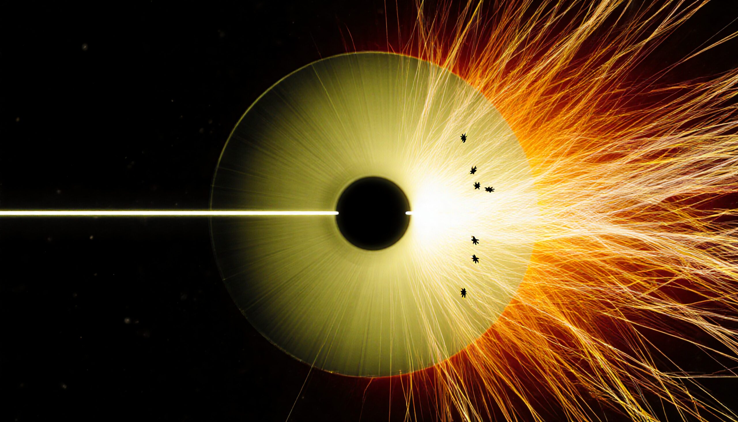 Circular welding process emitting fiery sparks in a dark setting.