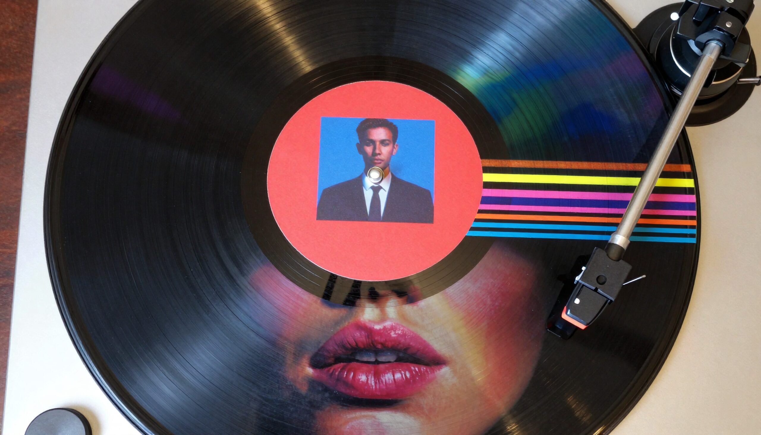 Colorful vinyl record spinning on a turntable with unique label.